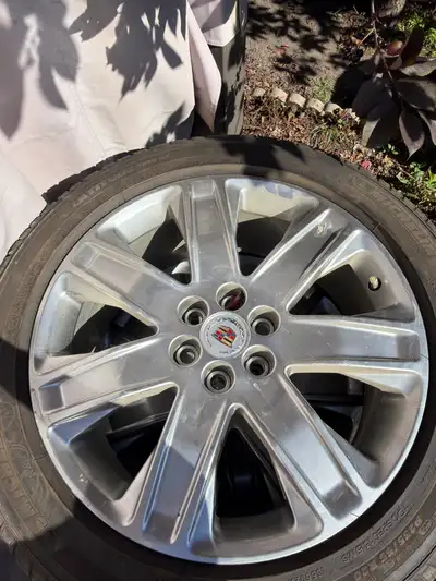 Tire and rims for an SLT All season, OEM. Cadillac SLT 2016 tire lug nuts for 25$ Serious inquiries...