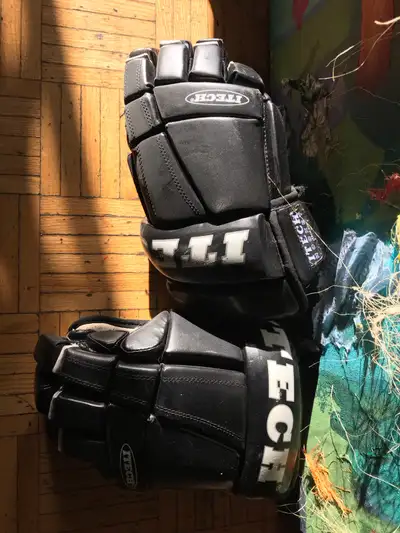  hockey gloves, and elbow pads , View more