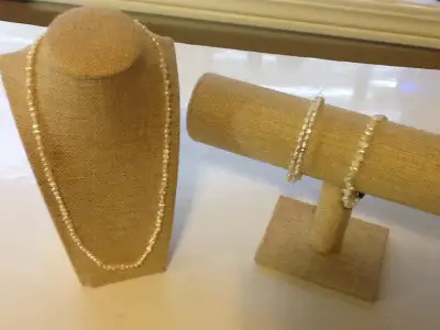 Lot of Freshwater Pearls Necklace and Two Bracelets, View more