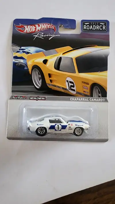 The 2012 ROADRCR Hot Wheels Racing Chaparral Camaro with Real Riders is a rare find for collectors a...