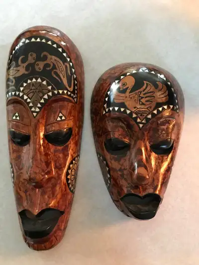 Hand Carved Wood Masks Purchased in Jamaica Measurements are: 13” high and 4.5” wide for the taller...