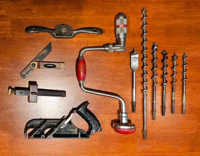 Woodworking tools from early- to mid-1900s: - Hand brace drill - Set of auger wood drill bits (longe...