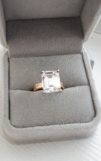 Emerald cut solitaire engagement ring