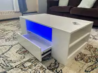 New in the box glossy led coffee table with storage 