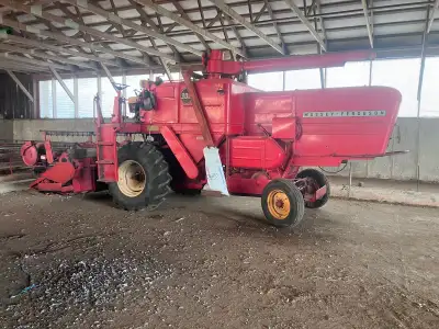 Massey 300 with straight head. In working condition. Was used for organic small grains. Has Chrysler...