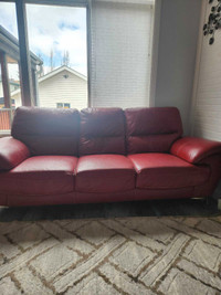 2 clean red couches