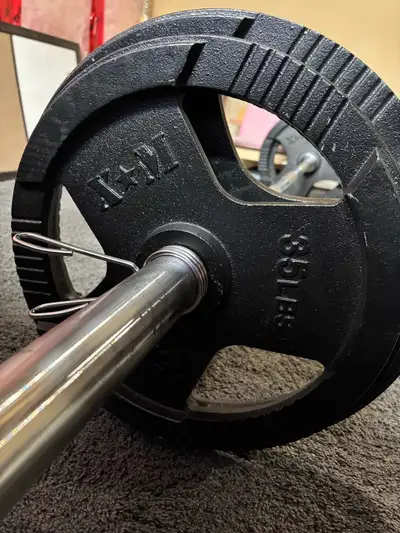 7ft Olympic bar 2 cast iron 45lbs 2 cast iron 35lbs All in like new condition. $200 together $80 for...