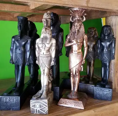 These Egyptian column statue reproductions stand 10 - 12 inches tall and come in a variety of carved...