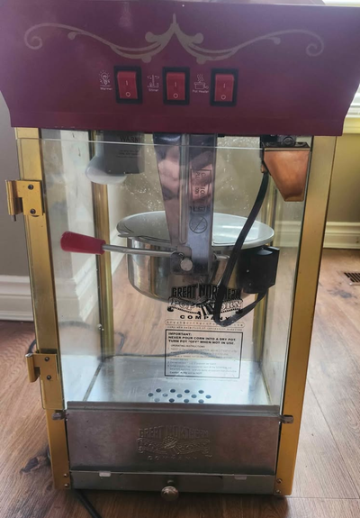 Popcorn machine like new. Comes with a few packages of popcorn and bags