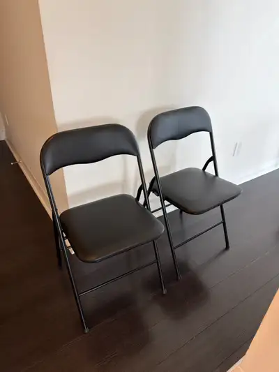Black folding chairs x2, View more