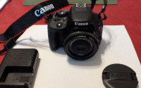Mint Canon SL1 compact DSLR, w/ 40mm, live view, touch screen +