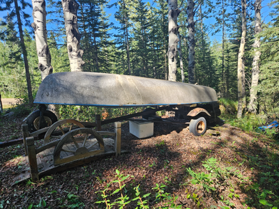 This sailboat and trailer need some TLC. With some work, it could look like the photo in front of bu...