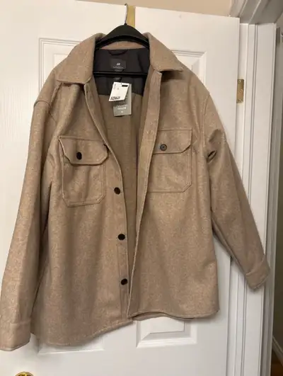 This NEW H&M oversized shacket (size XL) is the perfect blend of style and comfort, featuring a rela...