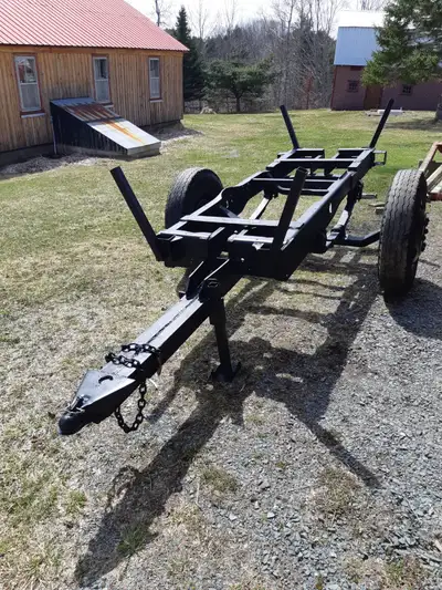 Pull trailer , about 4 x 8ft frame plus tongue. Wheels are wide enough to put 4ft wood cross ways wi...