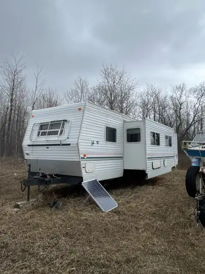 49 foot camper sleeps 8 central AC propane furnace, two outside doors large slide out! Has hail dama...