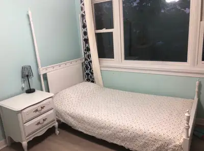 White twin bed set is in a French style, made from solid wood, with gold-accented handles. Includes...