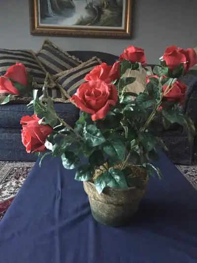 - Artificial rose plant with red flowers. - 19” H x 18” W - From a smoke free, pet free home. No del...