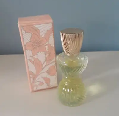 Avon Cologne Petite Moonwind - in a ribbed, hourglass shaped collectible glass bottle with a gold pl...