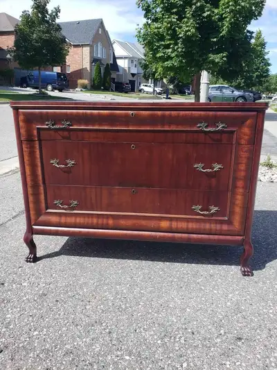 This is a beautiful solid wood antique dresser which was restain, View more