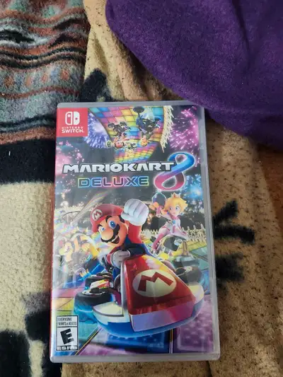 Get ready to race with Mario Kart 8 Deluxe on the Nintendo Switch! This game delivers thrilling kart...