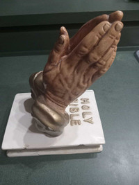 VINTAGE PRAYER HANDS WITH THE HOLY BIBLE.