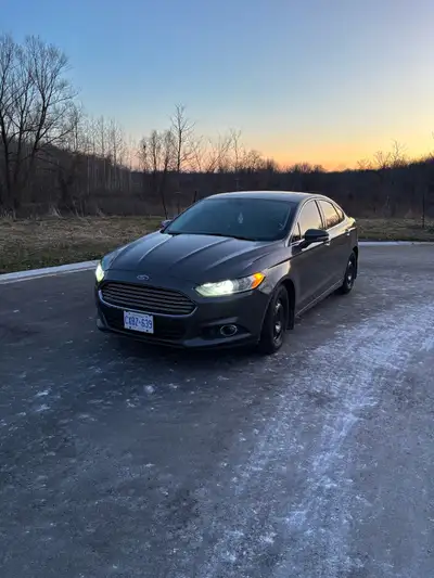 Selling my 2015 Ford Fusion Runs and drives great Comes with a set of summer tires on rims 249,600km...