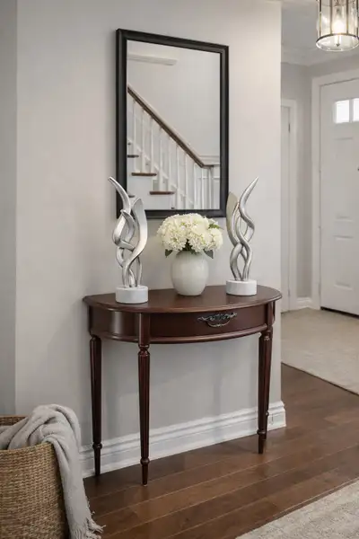 This elegant, used half-moon hall table is perfect for entryways or hallways, offering both style an...