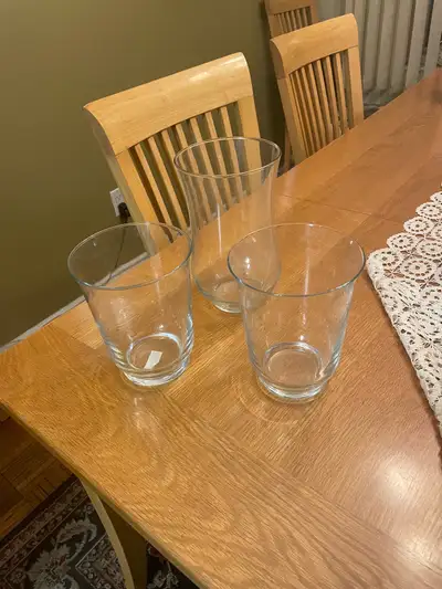 Add a touch of elegance to your home with this set of three glass vases, perfect for displaying flow...