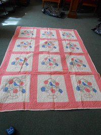 Double quilt with bluebird and basket and flowers