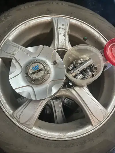 These pre-owned Bridgestone Blizzak WS80 winter tires, sized 205/55R16, come mounted on rims with in...