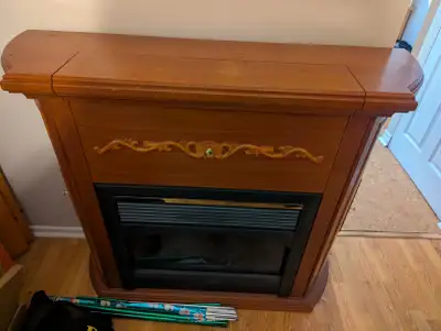 Electric fireplace with wooden mantel (fireplace does not work), View more