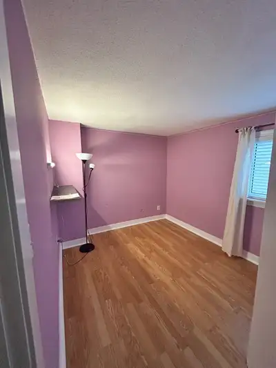 A private, well-lit room located on the upper floor of a quiet home at 50 Silverbell Grove, Scarboro...