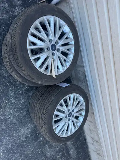 $1000 bucks obo 60,000 km on them. Lots of life left. Rims are like new