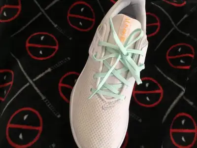 Women’s Nike running shoes, size 10 colour white and turquoise I paid 279 they just didn’t fit only...