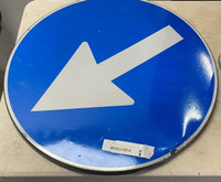 Blue, circular arrow traffic sign