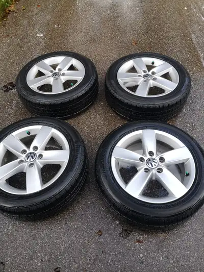 Set of VW 16" alloy wheels and tires with good tread. Wheels in excellent condition.