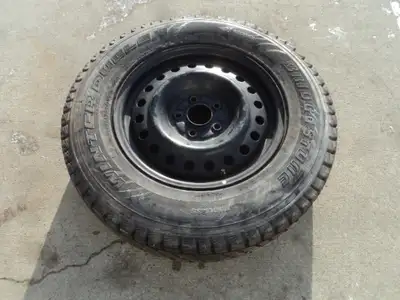 1 Bridgestone winter tire with steel rim is for sale. Tire is 225/70/16, 98% tread left. Rim is 5 ho...