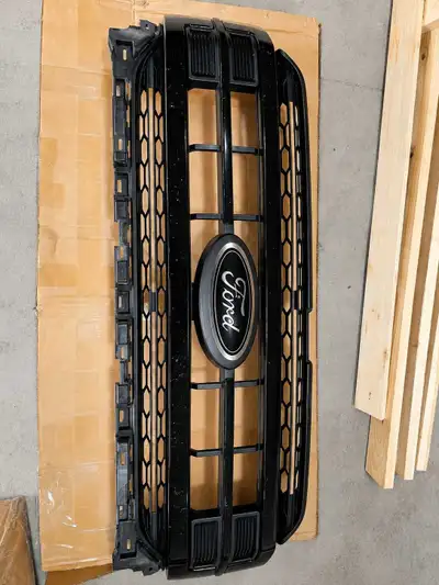 This is a black appearance package grille with a Ford emblem, originally from a 2022 F150. It's in u...