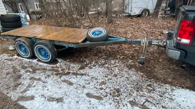 Tandem-axle utility trailer. 2” ball needed. Platform measures 50” X 106” overall trailer is 70” X 1...