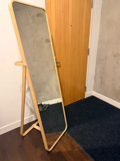 Standing mirror in an excellent condition with the option of hanging clothes behind it. Suitable for...