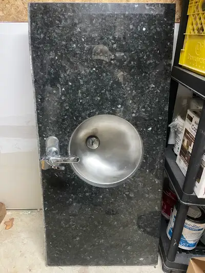 Granite countertop and stainless steel sink, View more