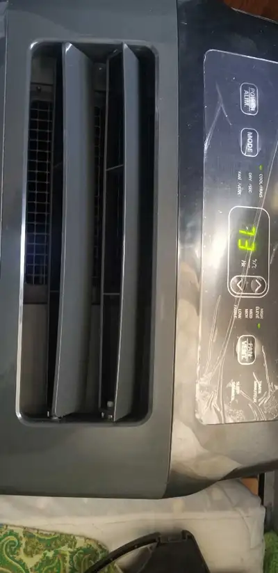 LG portable air conditioner "" works well "" includes exhaust hose and window kit "" grey in color A...