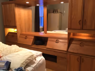 Headboard for sale in Cochrane. Will fit double queen & king size. Has 2 plugins 4 lights 8 storages...