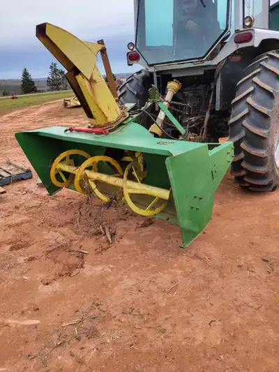 white tractor and snow blower, View more