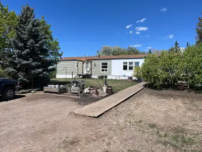 7 acres 2miles south of Stettler right off pavement. Renovated 90’s mobile and 32x40 heated shop. Lo...