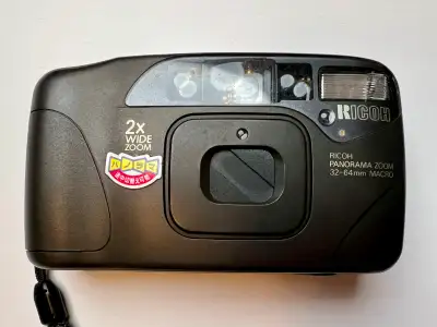 Clean, tested Ricoh Myport Zoom 320P. Powers on, film advances, shutter and flash work. Compact auto...