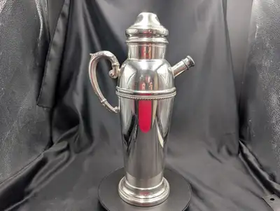 This vintage Art Deco cocktail shaker pitcher is a striking example of 1920s–1930s barware design, c...