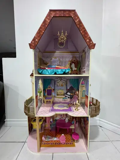 This is a large, used dollhouse with plenty of accessories ready for a new home. The dollhouse has t...