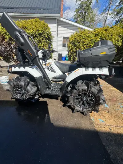 Powerful 2015 Polaris Sportsman 1000 XP with white and black body. This all-terrain vehicle has aggr...
