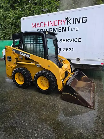 2012 john deere 313 skidsteer with 2700hrs. Enclosed cab with heat. quick attach coupler. hand contr...